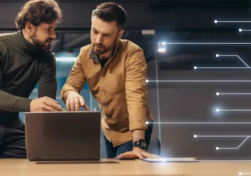 busy-confident-serious-european-young-businessmen-casual-with-laptop-talk-about-work-creating