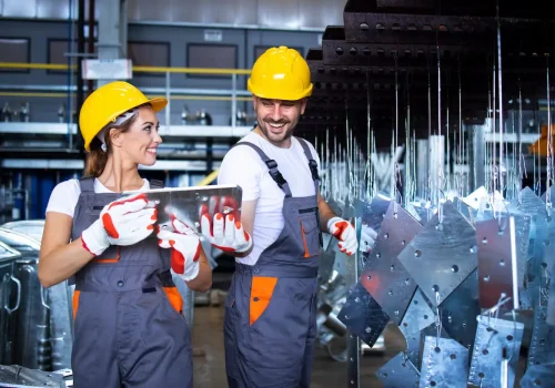 factory-workers-working-together-industrial-metal-production-line